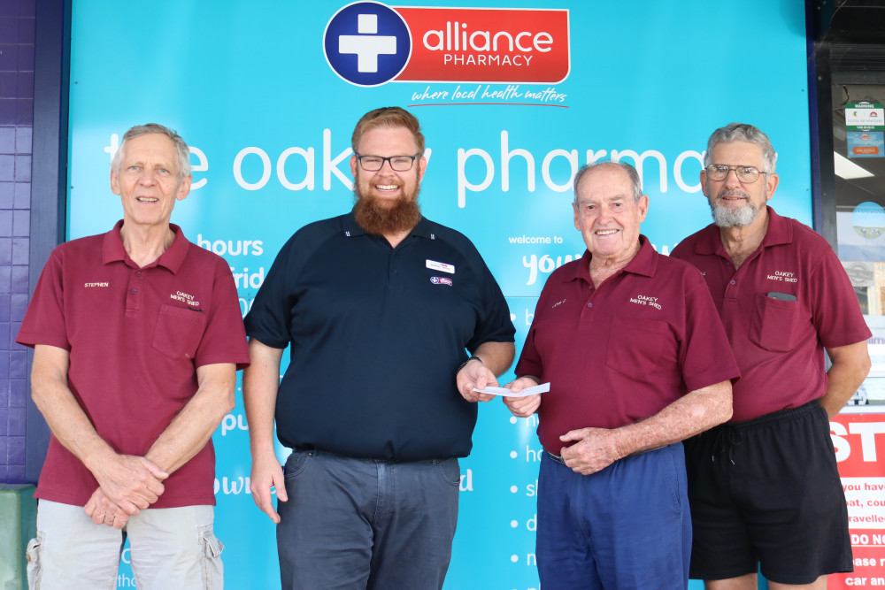 The Oakey Pharmacy co-owner and pharmacist Nathan Jervis presents a cheque donation to representatives from the Oakey Men’s Shed including treasurer Stephen Clarke, president John Greenhalgh and secretary Graeme Garvis.