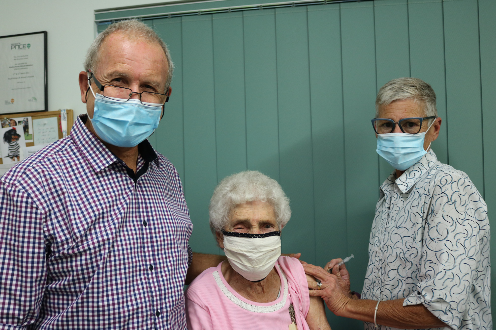 : Edna Bryce, aged 102, is administered Pittsworth’s first COVID-19 vaccine by Pittsworth Medical Centre’s Doctor David Reid and practice nurse Bronwyn Lewis.