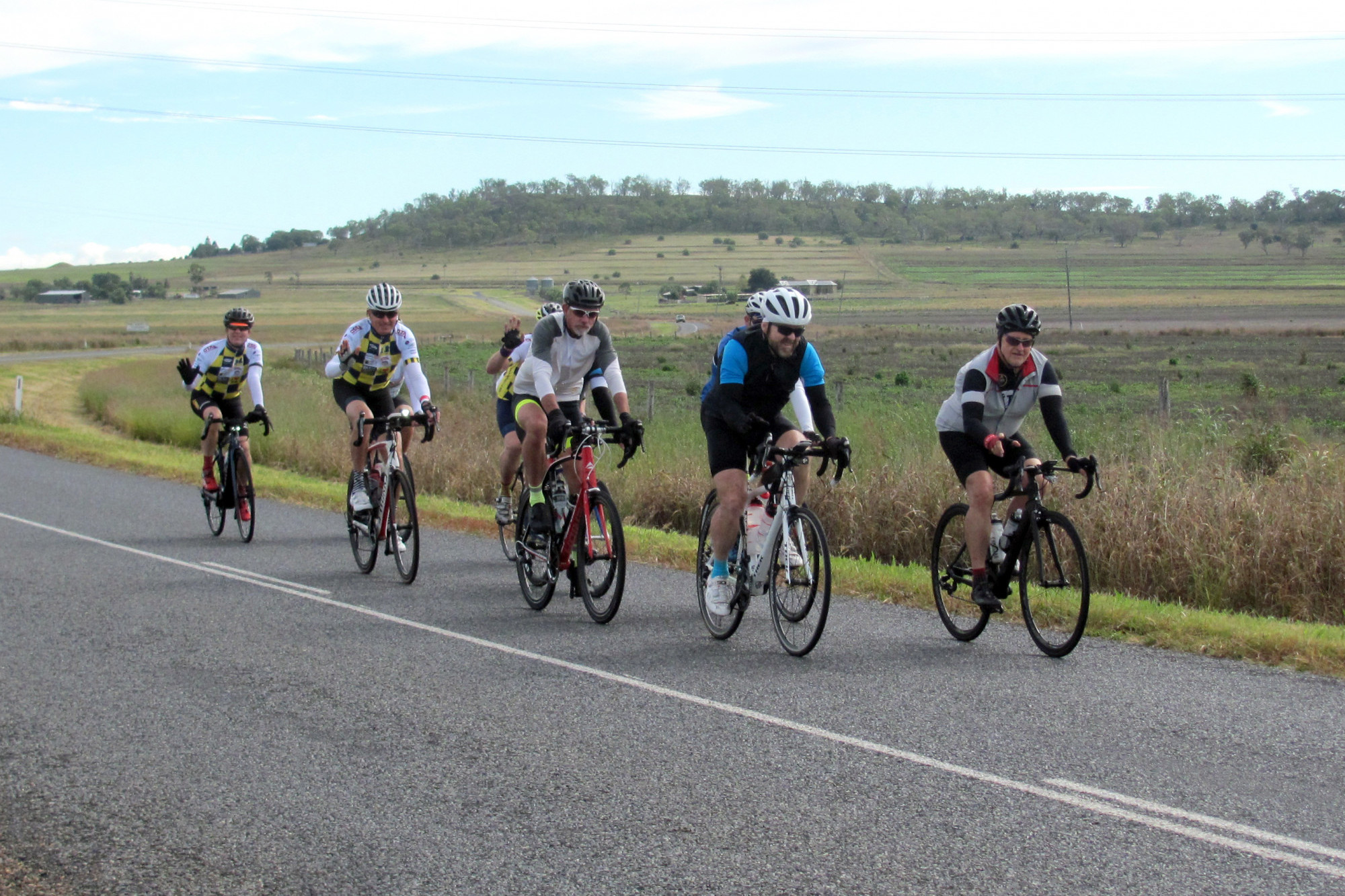 The Kits for Cops cyclists making their way between Cambooya and Greenmount on Cudmore Road.