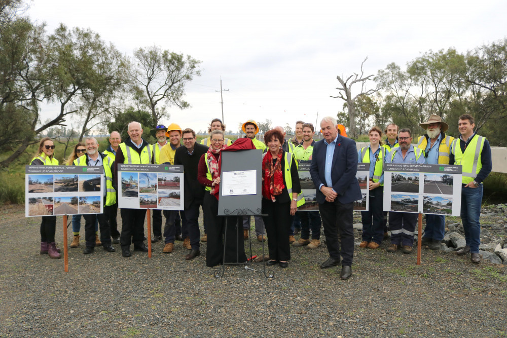 From front left, Toowoomba Regional Council (TRC) Deputy Mayor Councillor Geoff McDonald, TRC Infrastructure Services portfolio leader Councillor Melissa Taylor, TRC Infrastructure Services Committee chair Councillor Carol Taylor and Toowoomba Region Mayor Paul Antonio are pictured with TRC Infrastructure Services Group executives and construction crews at the opening of the $2.5 million Tummaville Road bridge replacement project which took place last Thursday.