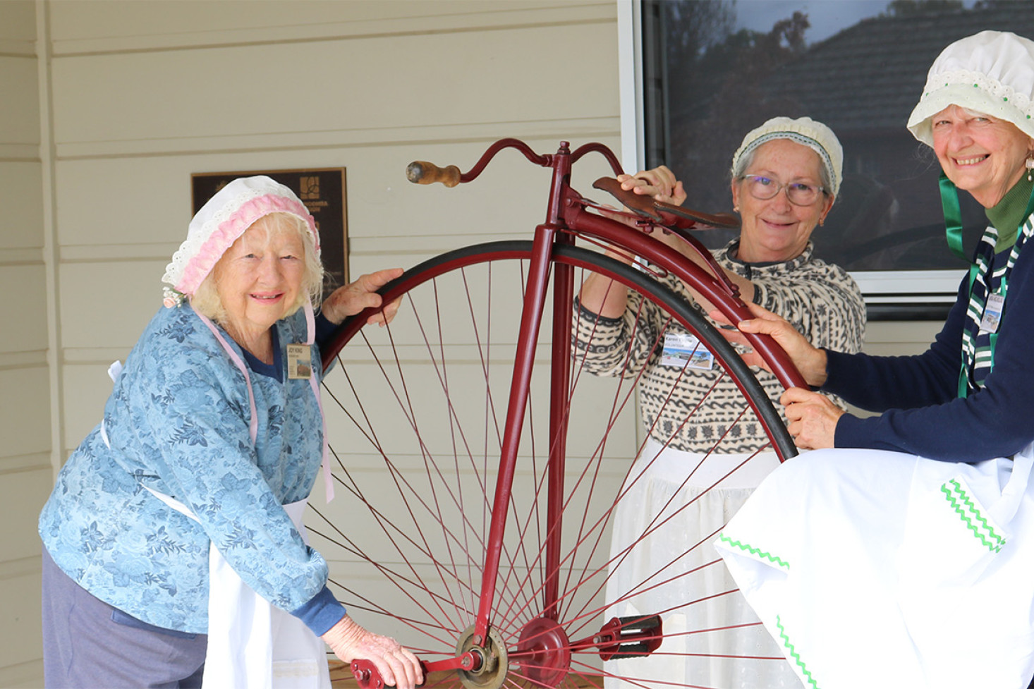 Clifton and District Historical Society volunteers, from left, Joy King, Karen Finnie and Linda Nicholas, have been busy preparing many special historical displays for the big day, including an old penny-farthing bicycle, loaned for the event by Ross and Trevor Neale. The costumes were made by the Clifton Dabblers and funded by Rhonda Glare.
