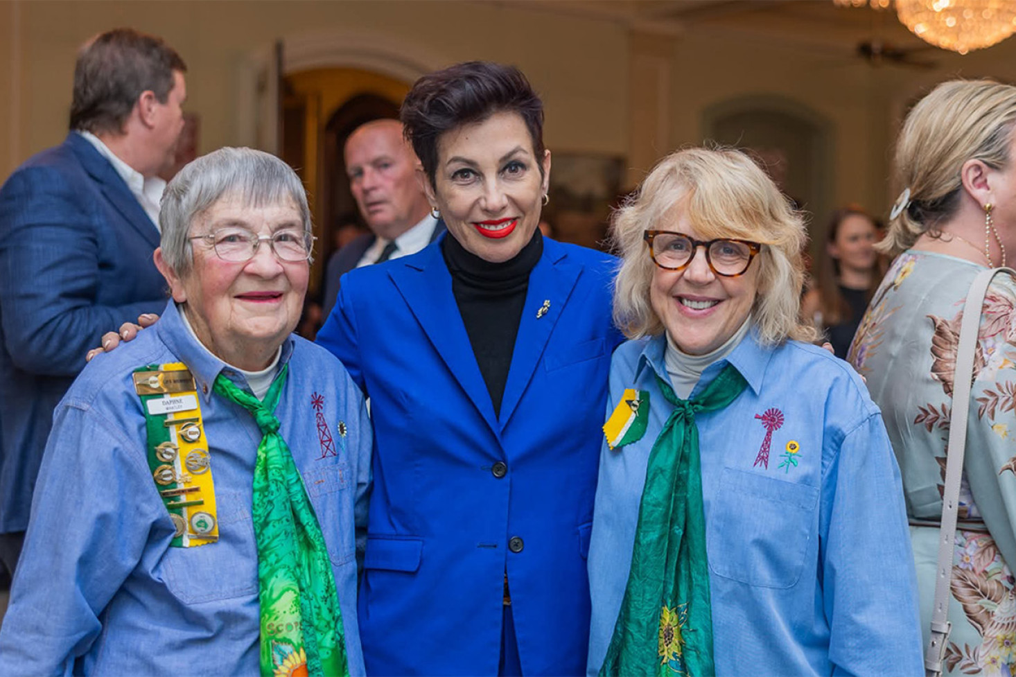 Allora Scope members Daph Whatley (left) and Lisa Reed (right) with a Government House official.