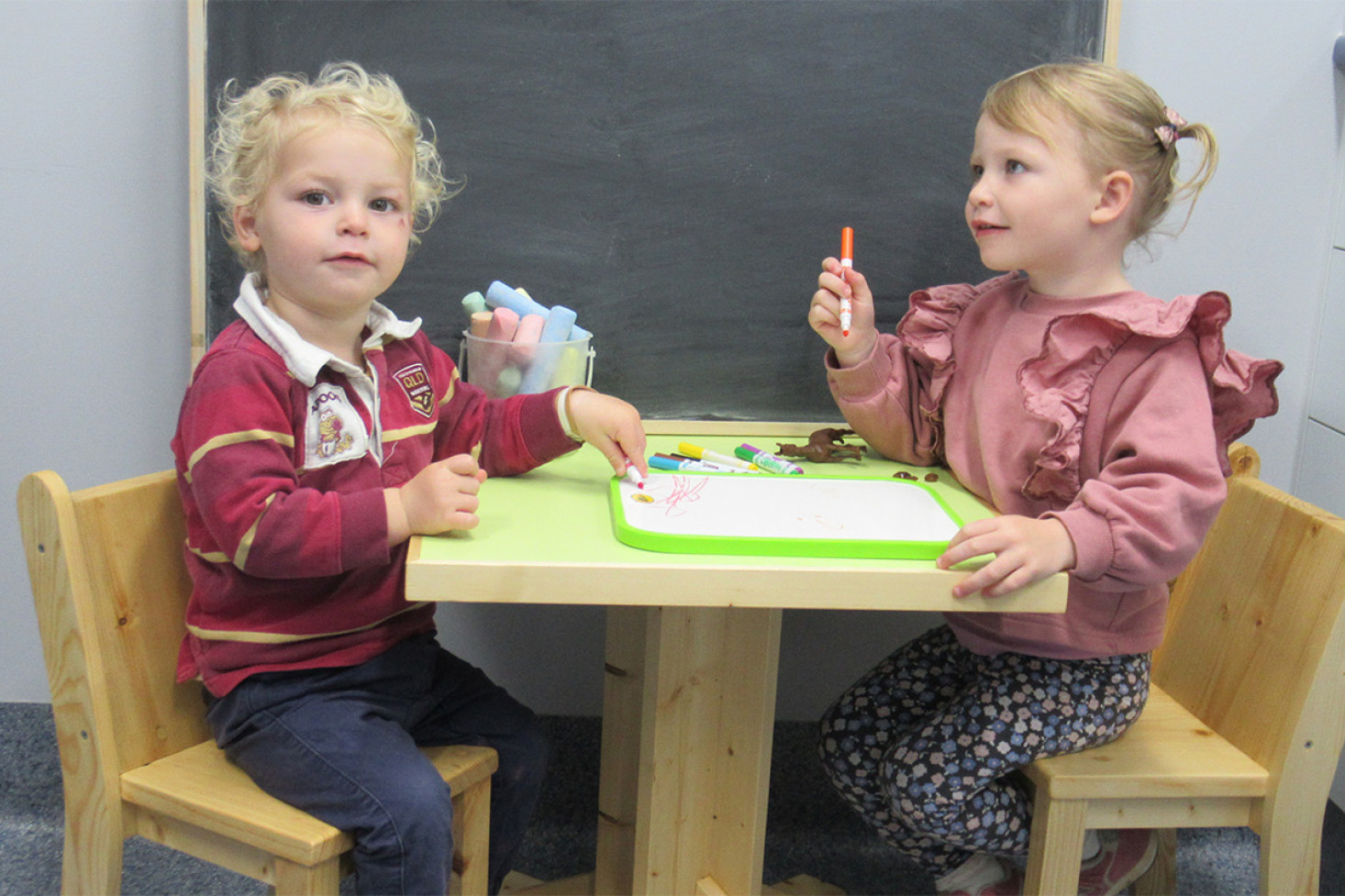 Mitchell (in the Qld Maroons Jersey) and Morgan Craig from Allora having fun on the new table and chairs.