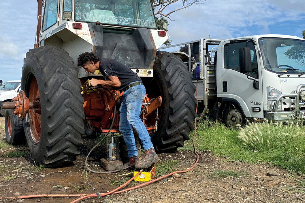 Kody working on a tractor tyre at a property out past Goomburra.