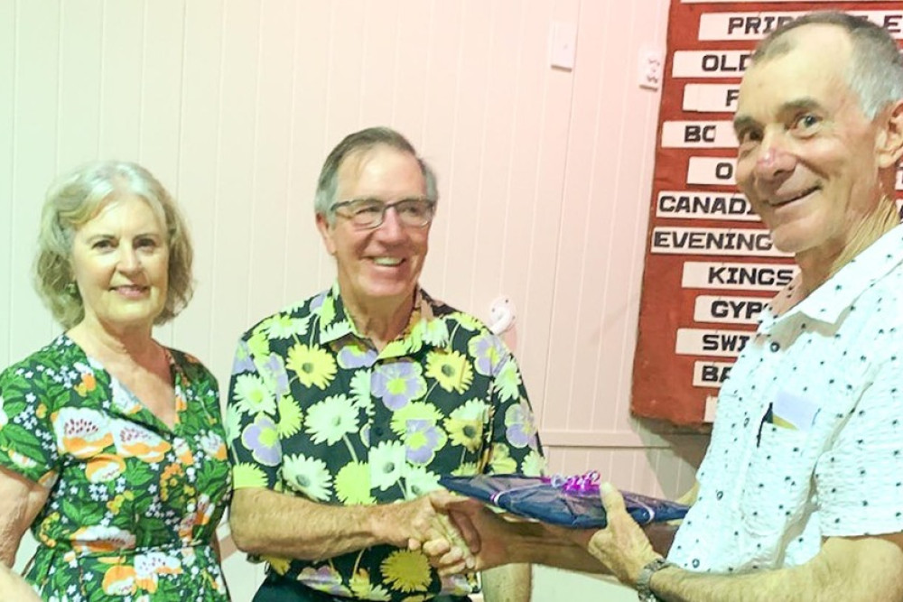 ABOVE: Paul Schutt (right) presents Bernadette and John McVeil with their prizes.