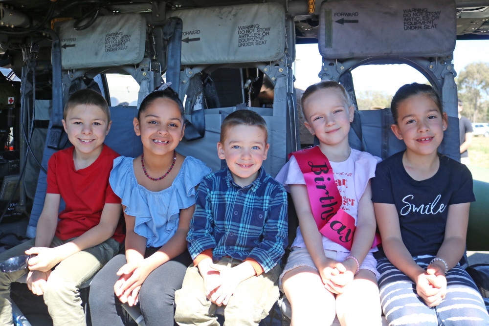 The Open Day drew crowds of families keen to check out the range of aircraft on display. Local children Liam, Vanessa, Archer, Imogen and Piper enjoyed having a peek inside one of the helicopters based at Swartz Barracks.