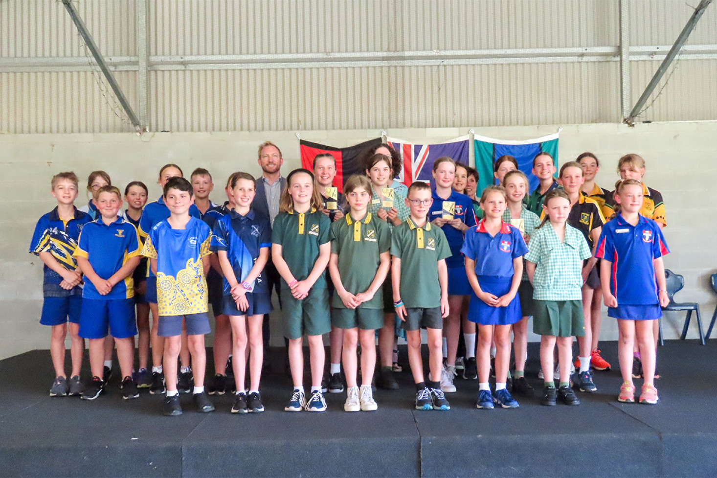 The three judges join all 26 participants at Back Plains State School.