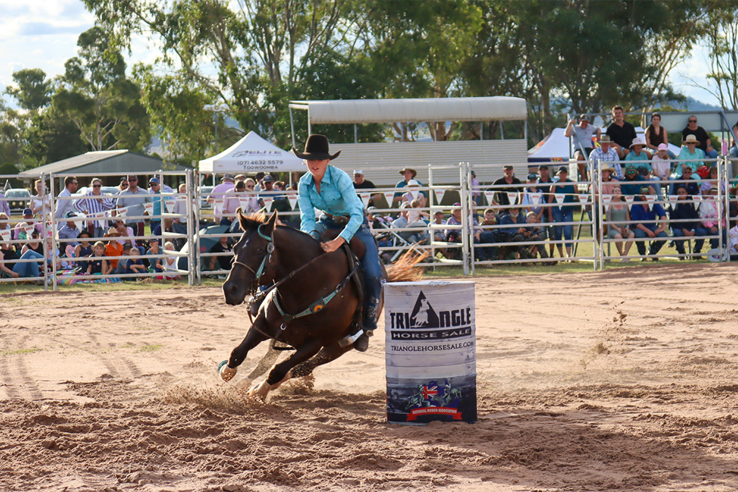 The Clifton Show rodeo started at a fast pace with barrel racing. Here, Aleta Bellingham from Warwick tests the skill of her horse.