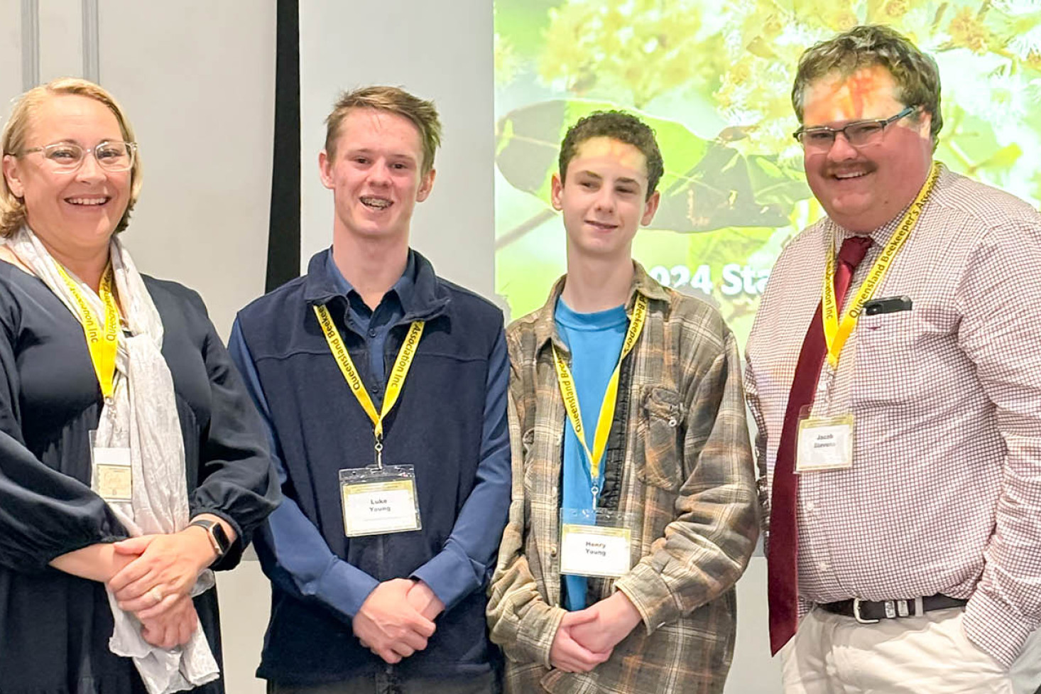 ABOVE: Luke Young (second from left) at the QBA Conference with brother Henry (second from right).