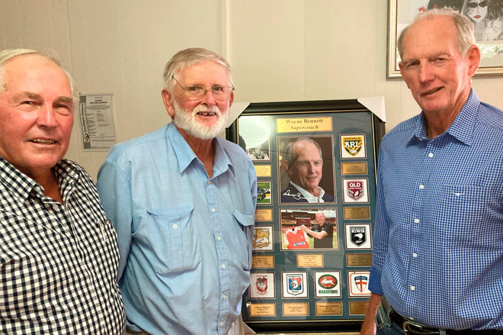 Enjoying some schoolboy memories are former St. Joseph’s (now St. Patrick’s) School Allora students and rugby league identities John Cowley, Peter Cavanagh and Wayne Bennett, with the framed tribute auctioned at Saturday’s Bennett Brothers Long Lunch. Photo, Ted Cavanagh