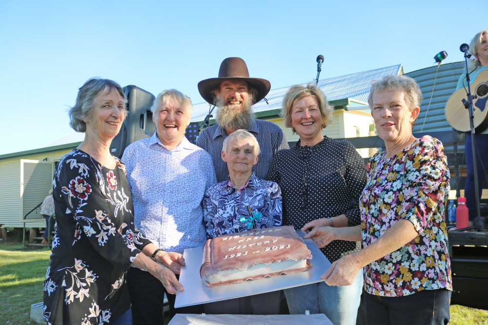 Biddeston Hall commttee members Margaret Clarke, Lyn Cotz, Jeff Gotz, Cynthia Donovan, Janice Cowie and Jenny Radke hold up the birthday cake cut in celebration of the Biddeston Hall turning 100.