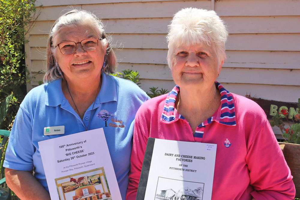 History Pittsworth volunteers Barb Walker and Gail Parish with the 100th Anniversary of Pittsworth ‘Big Cheese’ and Dairy and Cheese Making Factories of the Pittsworth District books available for purchase from the Pioneer Village.