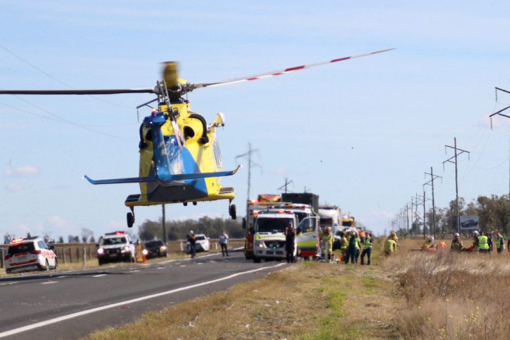 RACQ Lifeflight helicopter airlifts a patient from the scene.