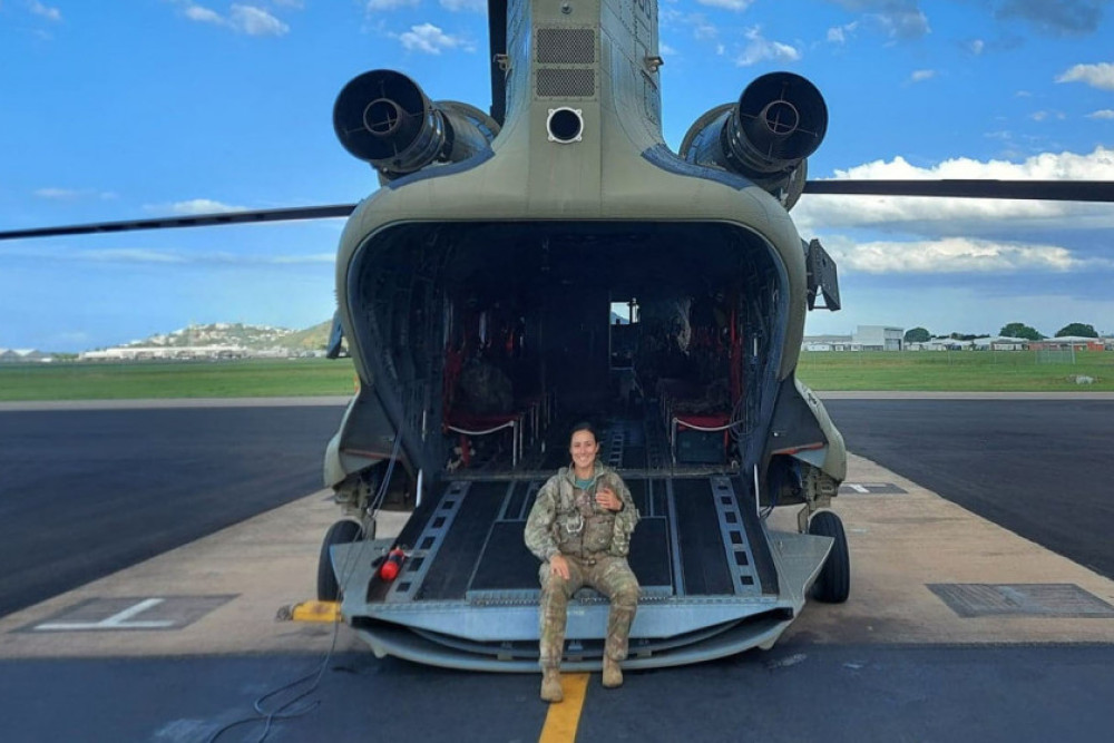 Captain Candice Priebbenow is dwarfed by one of the Chinook helicopters she flies.