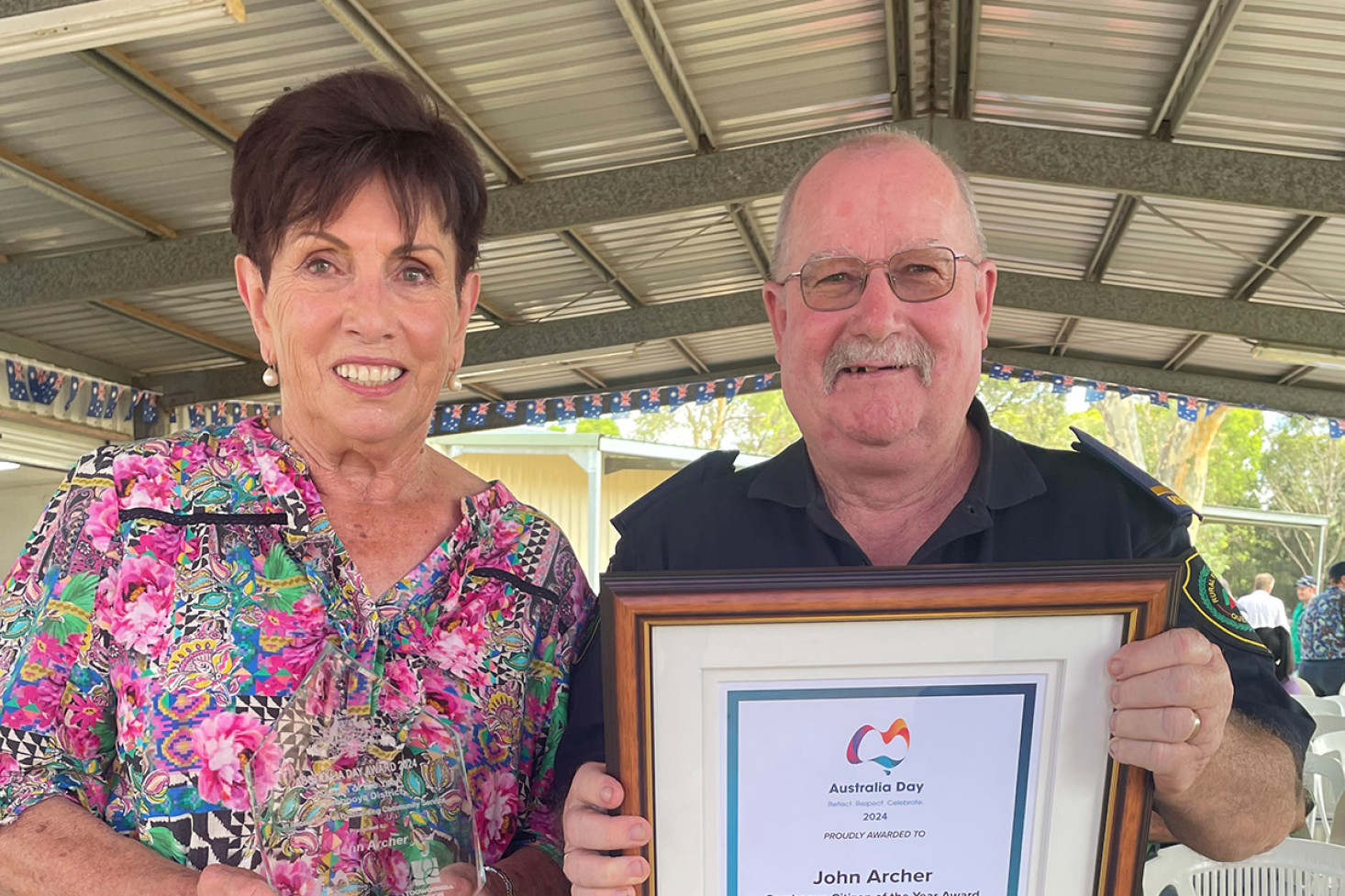 The 2024 Cambooya Citizen of the Year, Cambooya Rural Fire Brigade member John Archer, with Cr Carol Taylor.