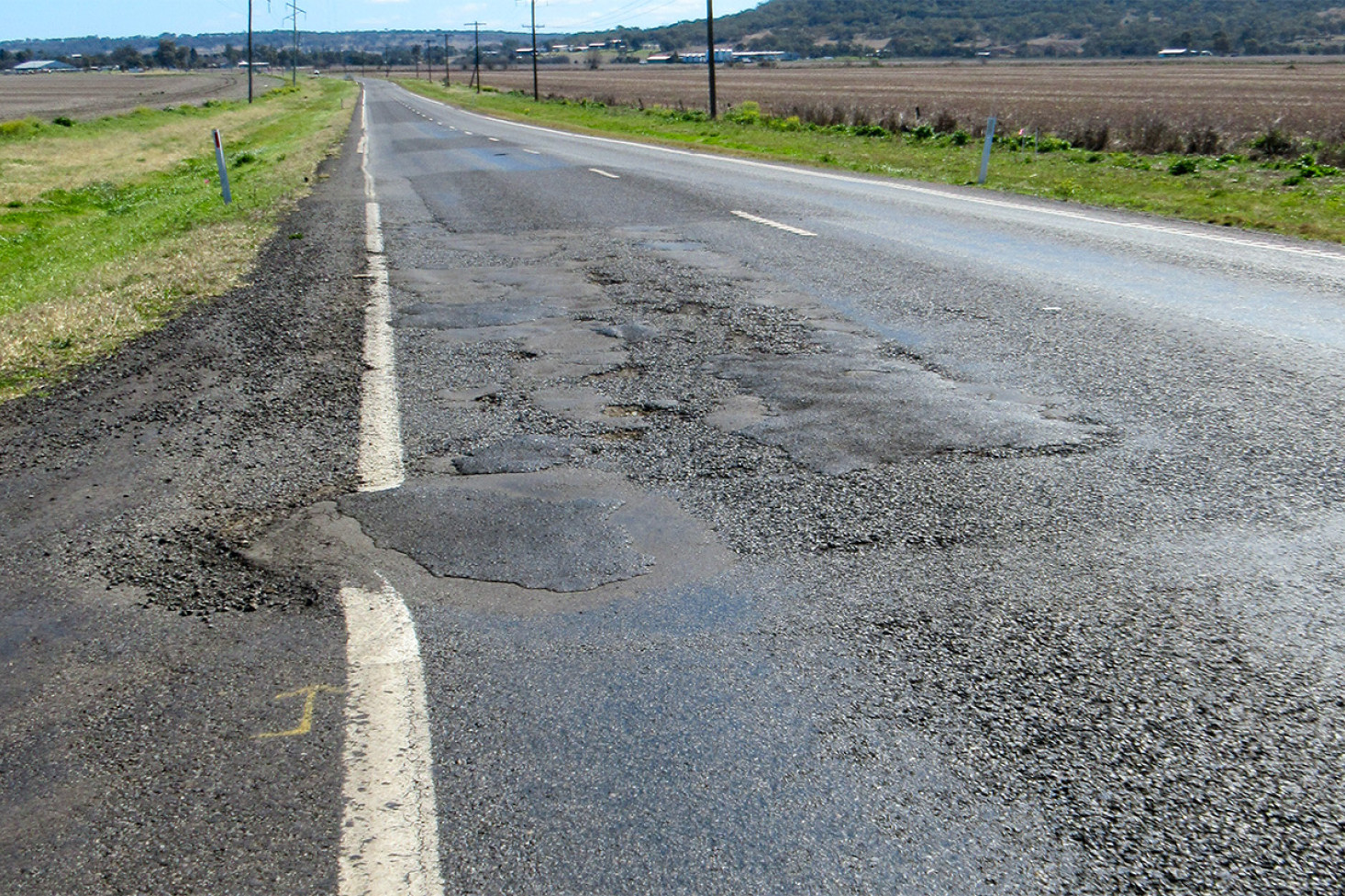 Poor road surface getting some love - feature photo