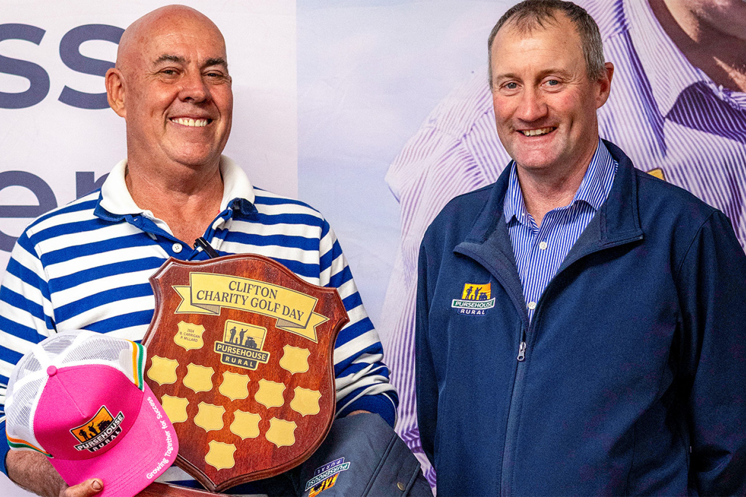 One of the winning team, Craig Foreman (left), holds the Charity Gold Day shield, with Pursehouse Rural Clifton Manager Chris Kunde (right).