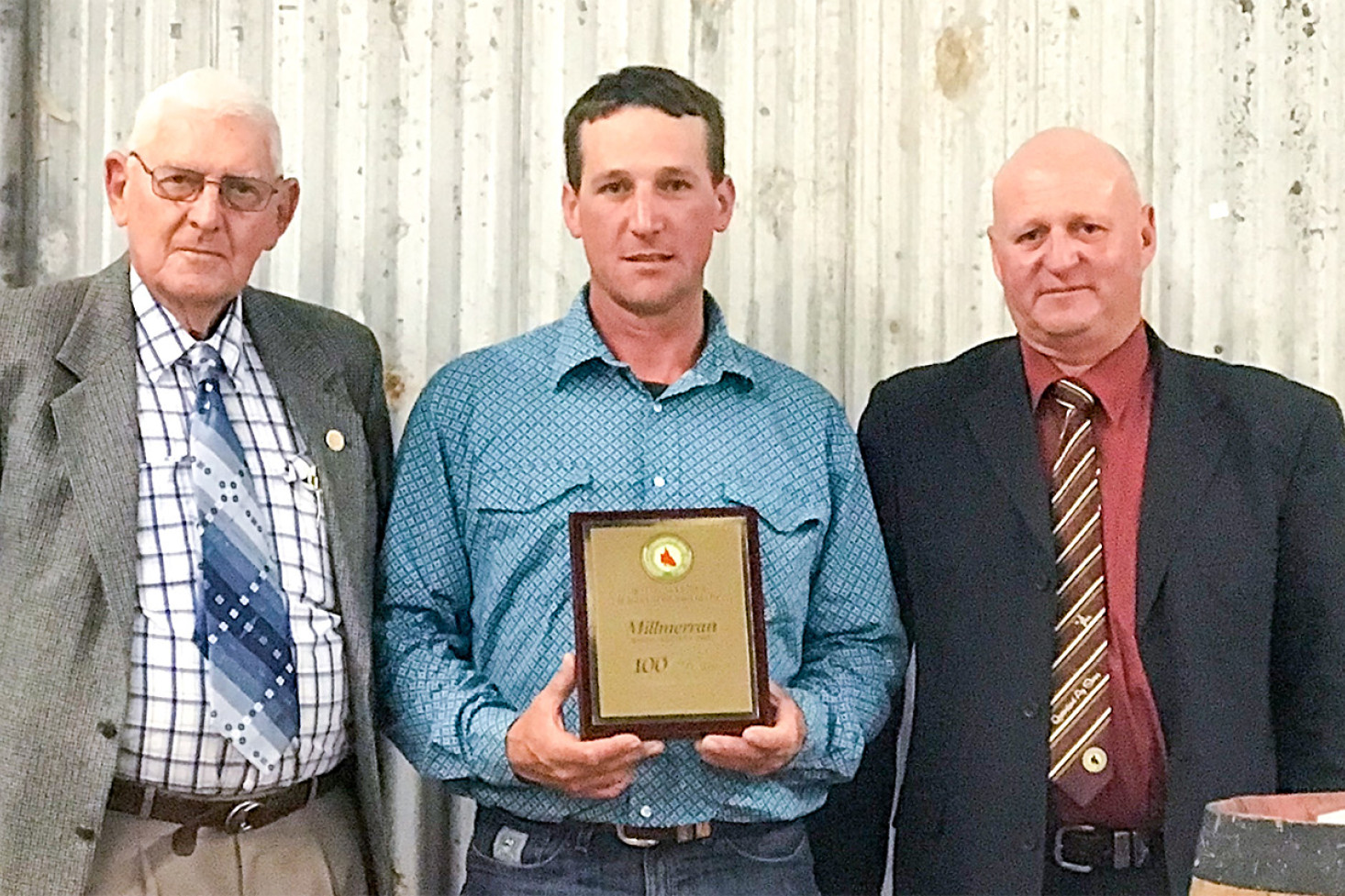 In recognition of 100 years since the first show was held in Millmerran, Brett Boatfield (right) President of the Stanthorpe Show Society and delegate of the Darling Downs Sub Chamber presented a plaque to Show Society Patron Neville Fitzgerald and President Matt Clark. Photo, Karen Dieckmann
