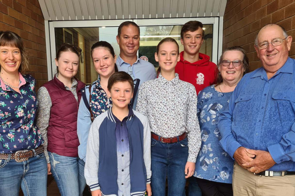 After receiving the keys to the facility, Katrina and Adrian Hobbs (left and centre), their five children, and Katrina’s parents Jennifer and Andrew Youngberry (right) stand excitedly outside the former Weis factory which will now be the site for their new venture Country Synergy.