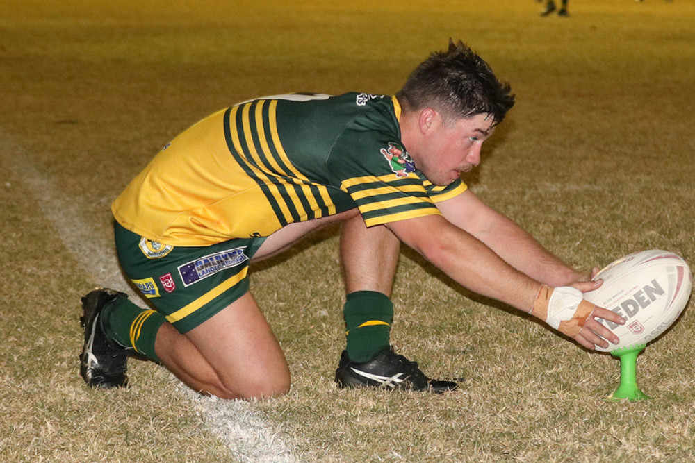 Wattles’ A Grade half-back Brayden Paix prepares for one of seven goals he kicked against Oakey.