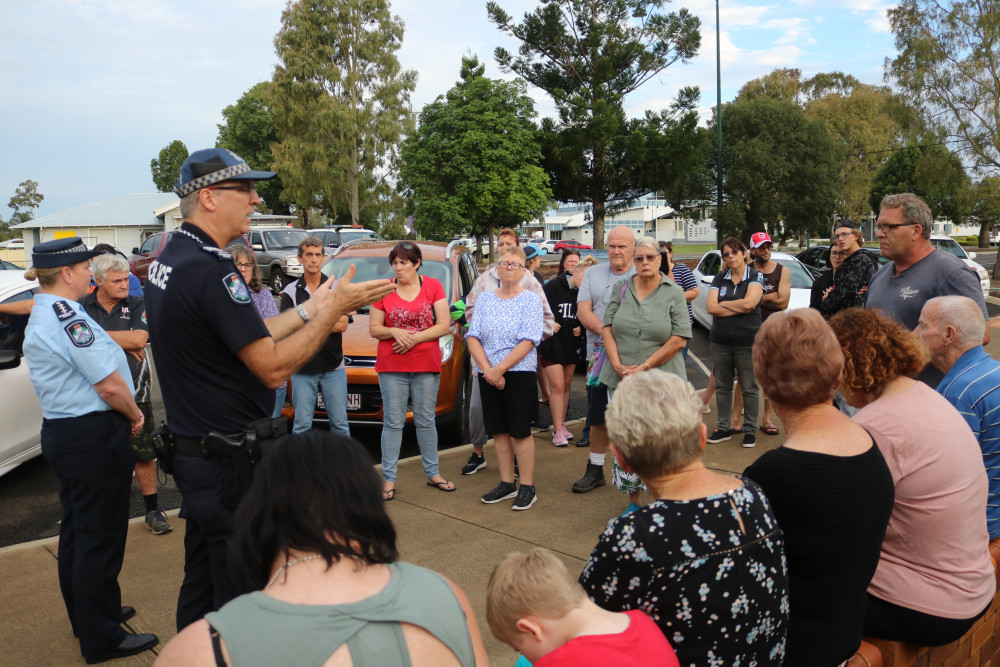 Acting Inspector Fiona Hinshelwood and Sergeant John Cook talk to concerned residents at a public meeting outside the Oakey Police Station on Friday.