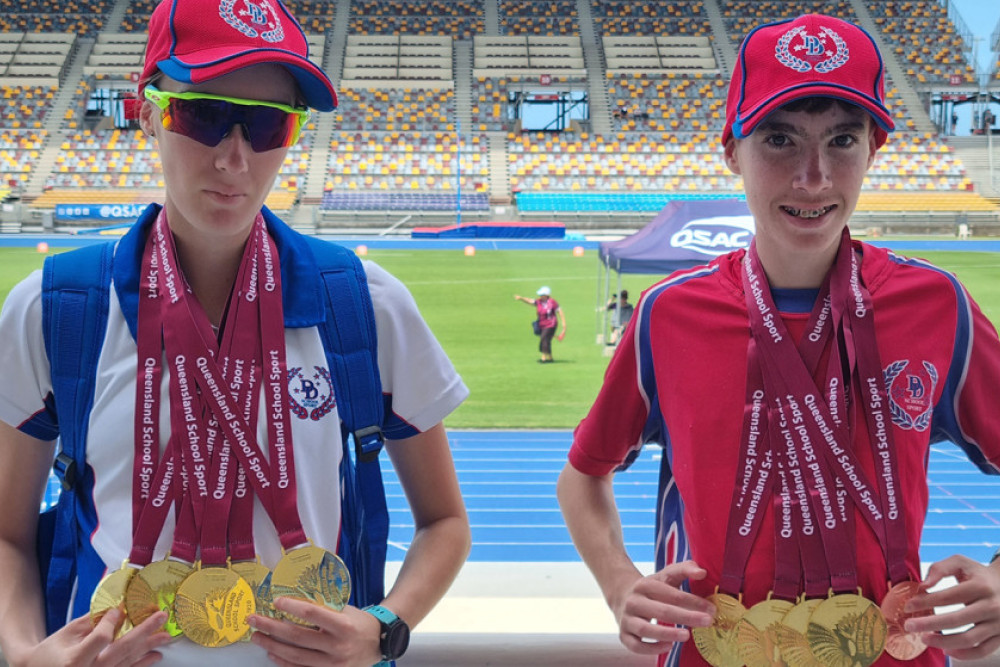 Kyrna and Tomas Crump with their medal hauls.