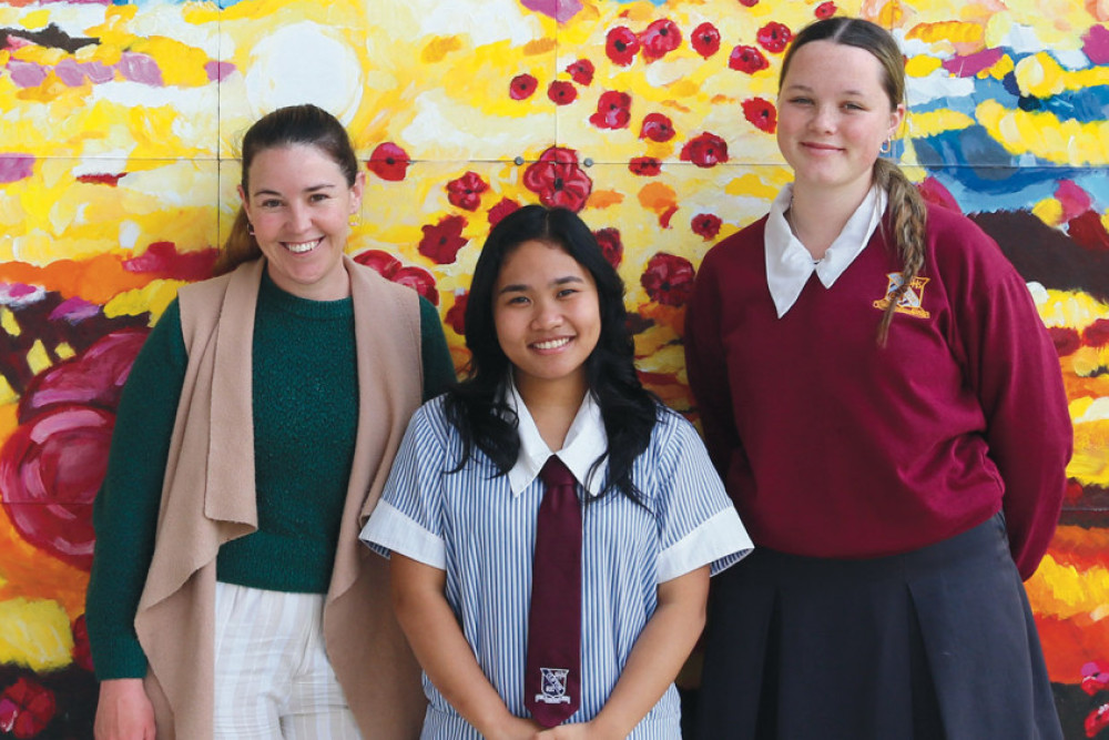 From left: Legal Studies teacher Celeste White and high-performing students Julianne Espana and Brianna Naumann.