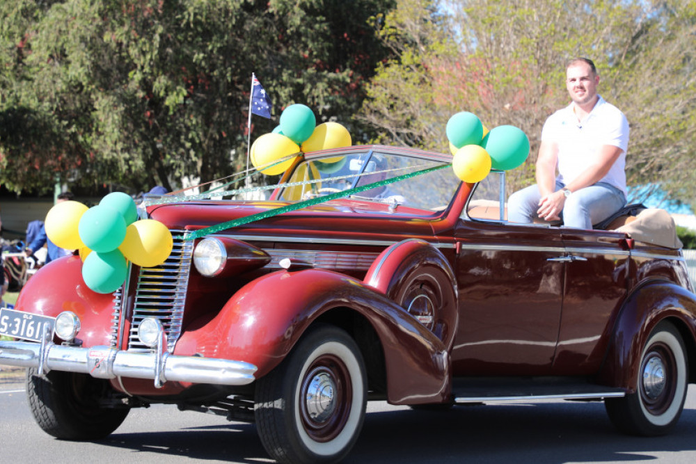 From the rear of his uncle Bob’s convertible sedan, Matthew Denny was able to take in the enormity of the welcome afforded him by the people of Allora.