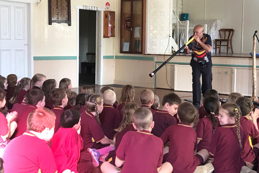 Tjupurru, from the Djabera Djabera people of the Kimberly region, performing for students in the Cambooya Community Hall.