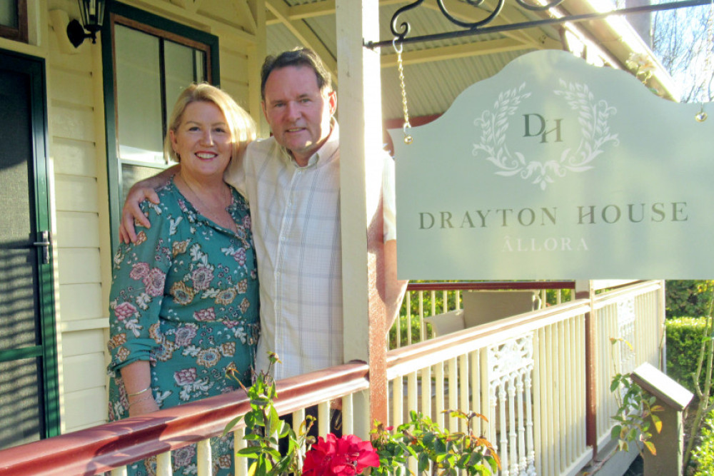 Kerry and George Smith on the veranda of Drayton House.