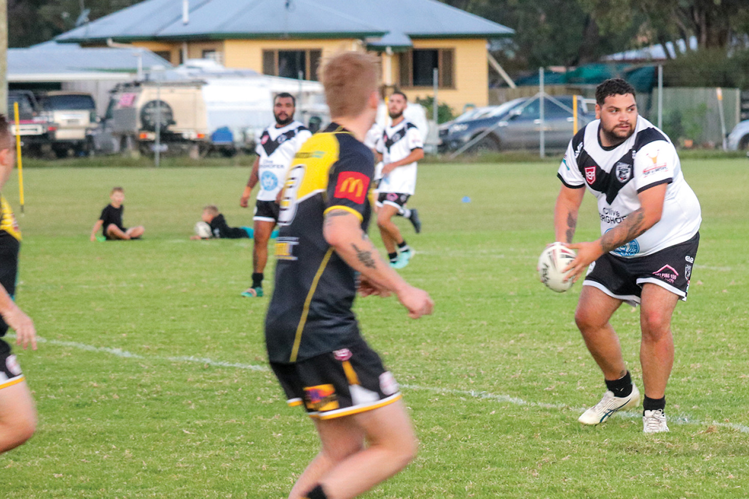 Dylan Crump pushes through a tackle in the reserves game.