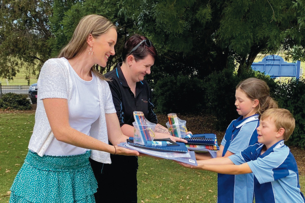 P&C Treasurer, Mrs Rachel Barron, and P&C Treasurer, Mrs Zoey Harper, with school books and stationery for 2023.