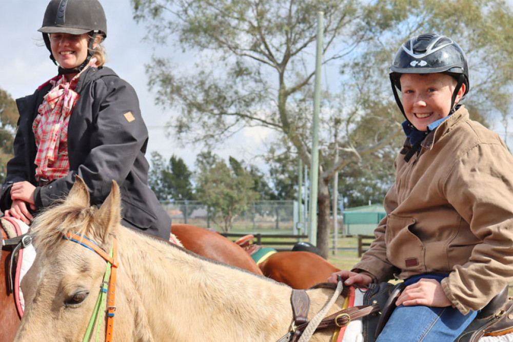 Among the smiling faces in Saturday’s brilliant sunshine, young Logan Leerentveld from Toowoomba on his 14 years old horse ‘Danny’. At the back is Logan’s sister, Brooke Leerentveld.