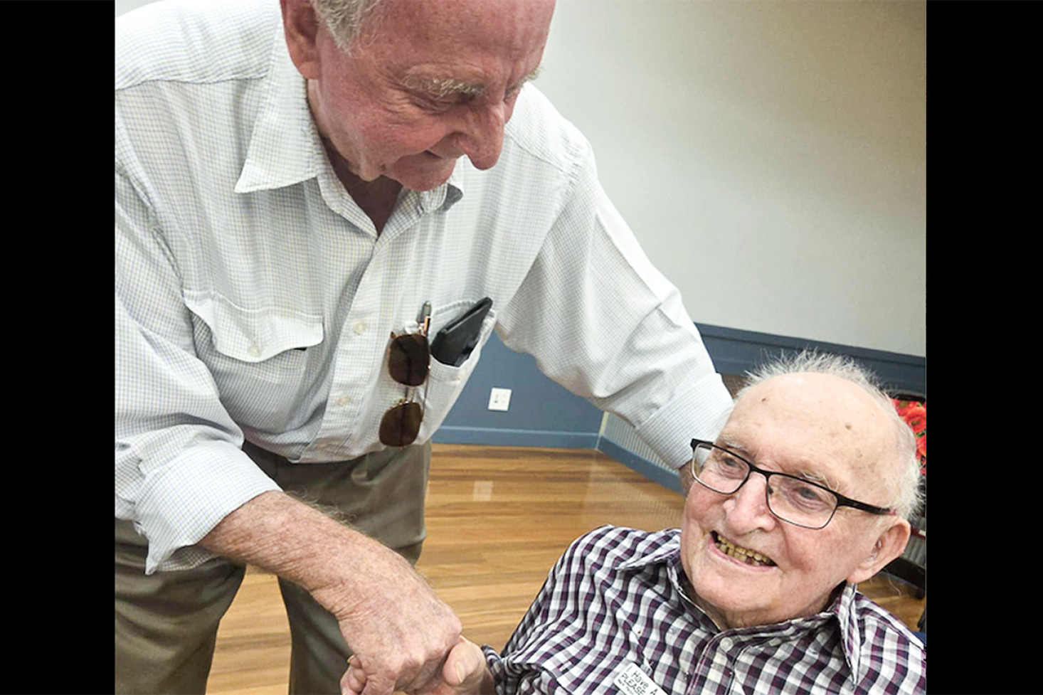 Kevin Byers (left) congratulates his uncle Eric Dorries on turning 102.