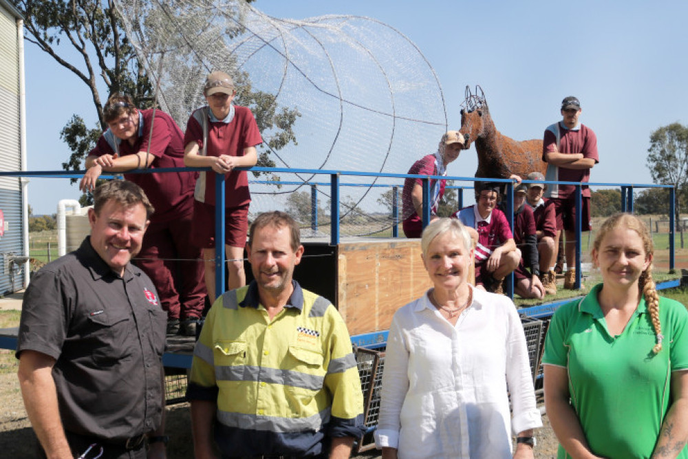 Oakey State High School teacher John Joyce, Coops Construction Queensland’s David Cooper, Heritage Bank community and sponsorship manager Jan Johnson and Oakey community carnival float coordinator Zoe Grainger inspect the progress on the float at the high school’s trade training centre.