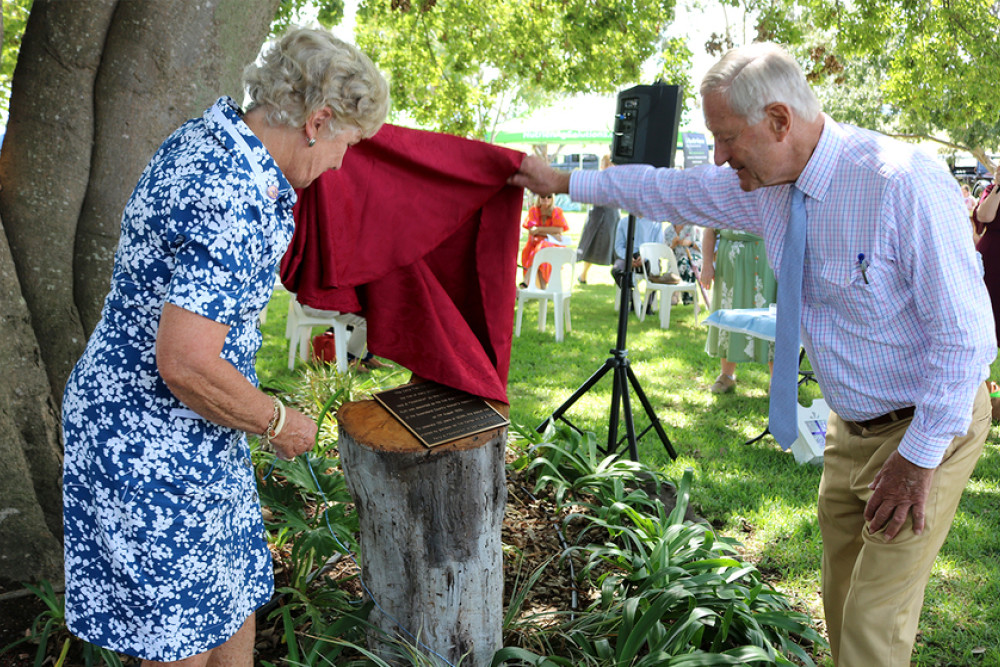 Tim Fairfax AC, a grandson of the founding president of QCWA Ruth B. Fairfax, was joined by his wife Gina tom unveil a plaque commemorating the 100th anniversary of the organisation.