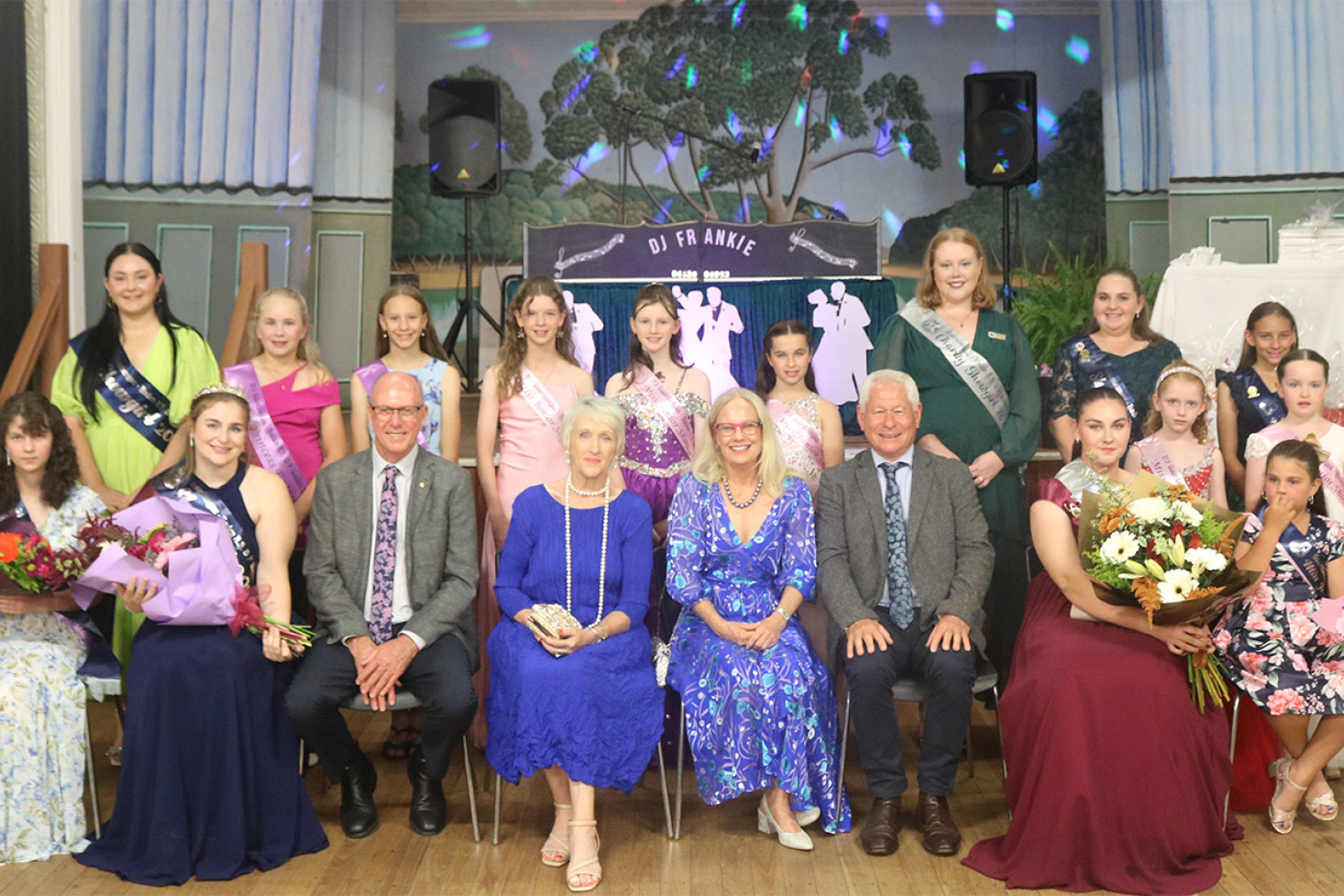 The dignitaries, showgirls and showgirl entrants following the announcement of the showgirls at the Goombungee-Haden Show Ball held on Saturday night at the Goombungee Hall.