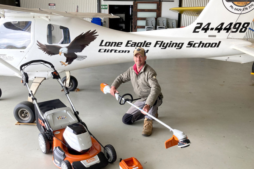 Steve Ure with the new gear, a push mower and heavy duty cordless brush cutter.