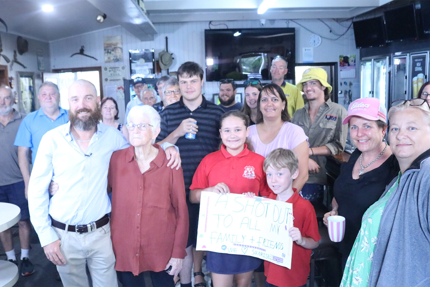 ABOVE TOP: Several regular pub customers and residents showed up for the early morning live cross on the Sunrise program.