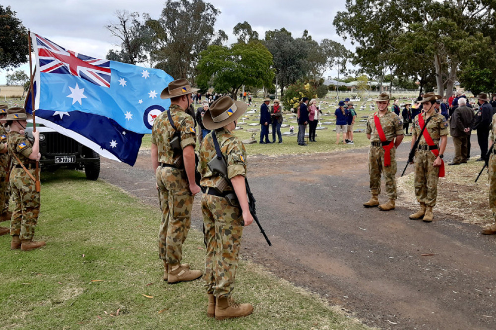 After placing a poppy on the grave of every ex-serviceman and woman, Pittsworth cadets form a guard of honour at the cemetery gates.