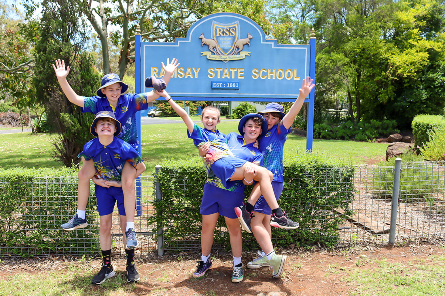 Graduating students Ryan Cameron, Chase Hilton, Ashton Robertson, Kane Robertson and Bianca O’Hern enjoy each others company before beginning the reflective walk up Ramsay Hill.