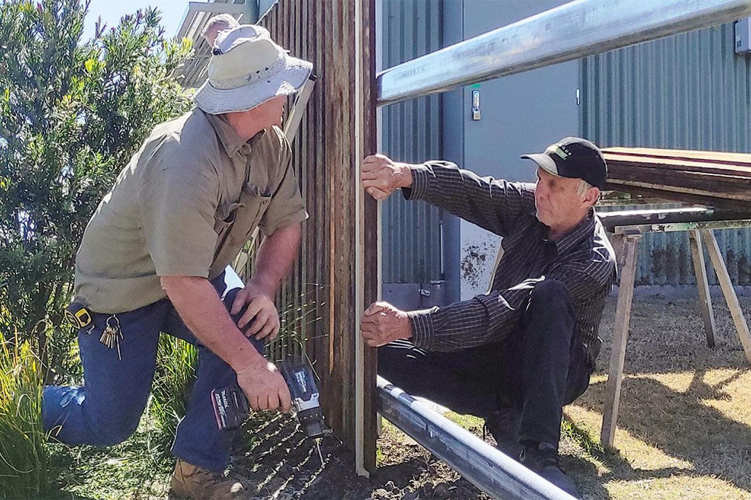 Dave Burns (right) working on constructing a new fence at the Clifton Museum, alongside Ian Mason.