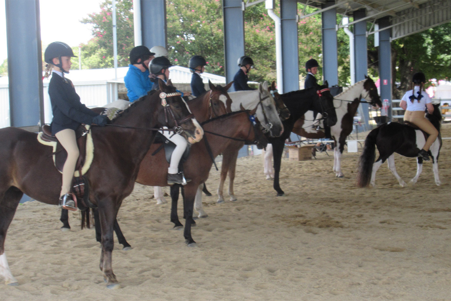 Young riders line up for their event under the “big top”.