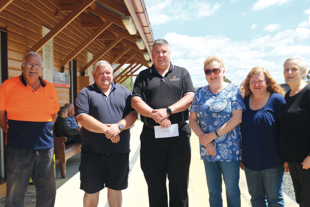 (Left to right) Raffle Coordinator John Webster, Volunteer Eric Haering, Bernborough Tavern owner Michael Carpenter, and other volunteers Suzanne Haering, Pam Gill and Carol Lee.