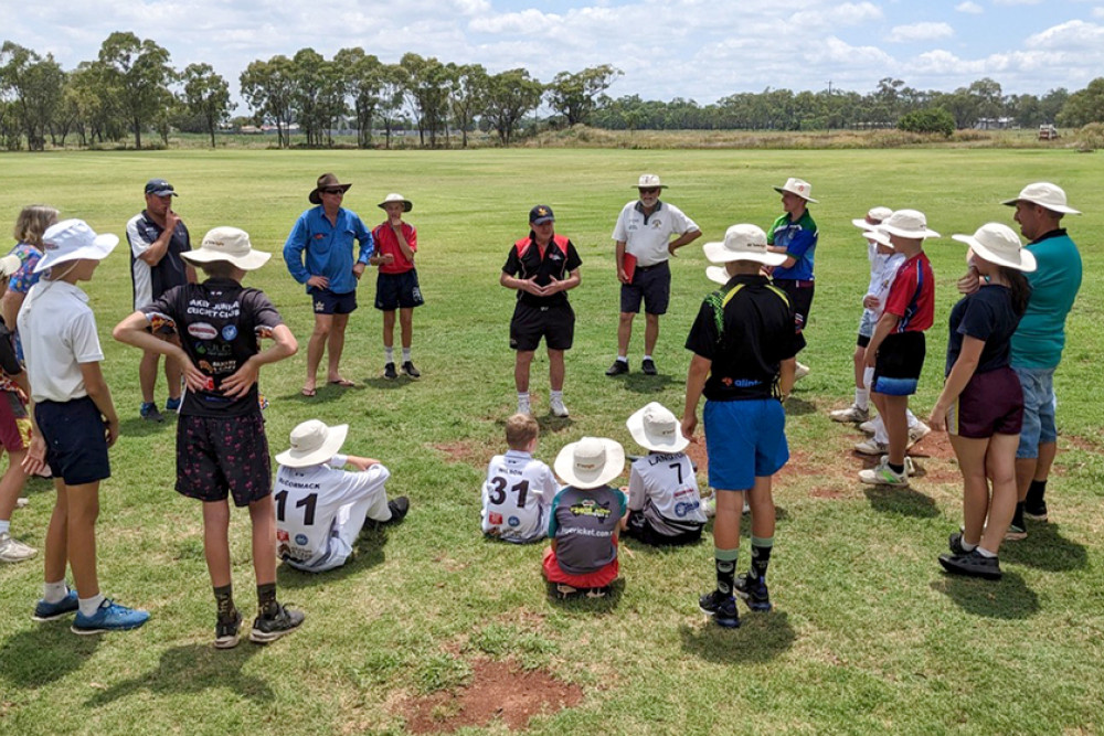 ABOVE: John Bell addresses local juniors at a coaching clinic at the Oakey Junior Cricket Club nets.