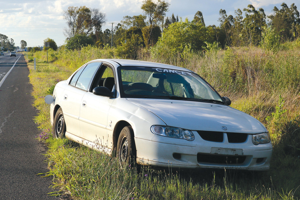 This vehicle was found abandoned alongside the Warrego Highway at Jondaryan with license plates removed, petrol tank cover opened and the window rolled down.