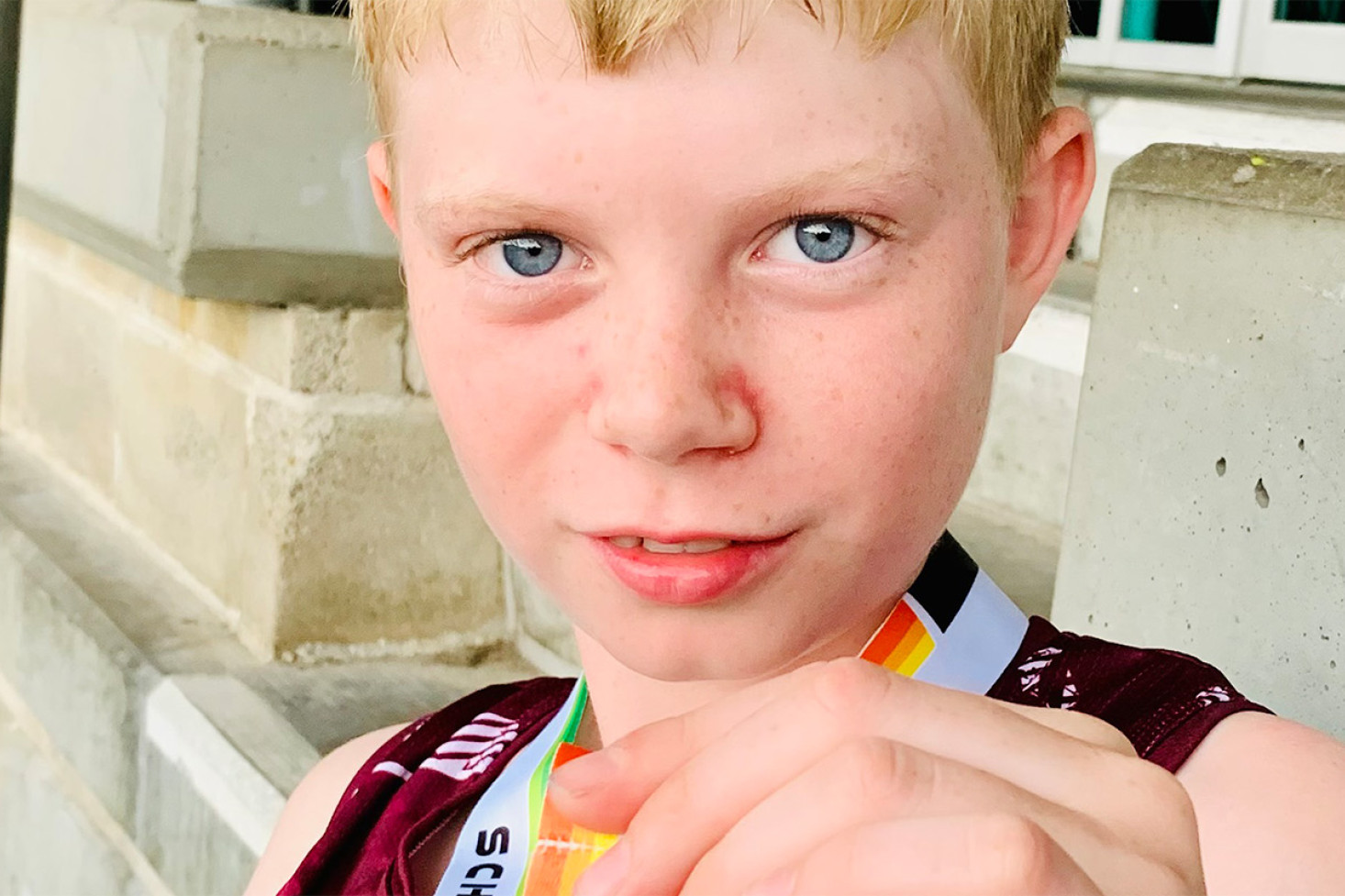 Joseph Ramsey with his silver medal from the 4x100m relay at the National Track and Field Championships.