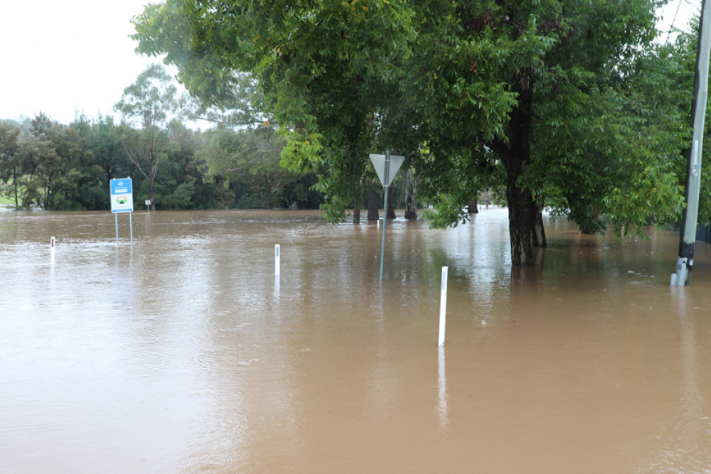 Lower parts of Jubb Street along the Dalrymple Creek are already experiencing flooding as the water continues to rise.