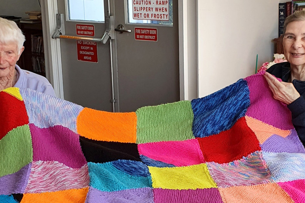 Residents Dot and Jo from the Allora Nursing Home have spent every spare moment knitting enough squares to make into a cosy blanket for someone who desperately needs extra warmth this winter.