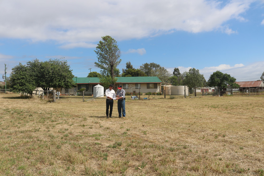 Pittsworth developers Mark Droney and Doug Cattell stand on the blocks in Margetts Street that they plan to subdivide into 35 residential lots. The house behind them will remain standing and be sold alongside the other blocks of land.